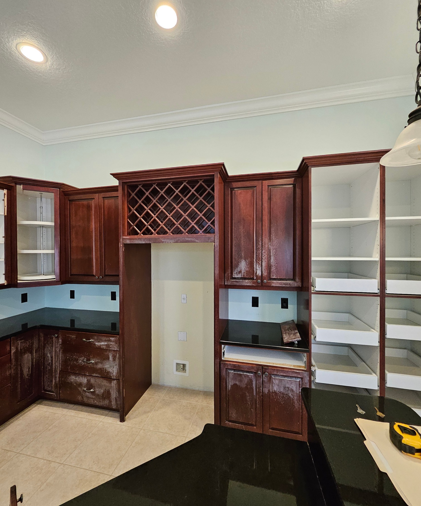 Kitchen before with dark wood cabinets