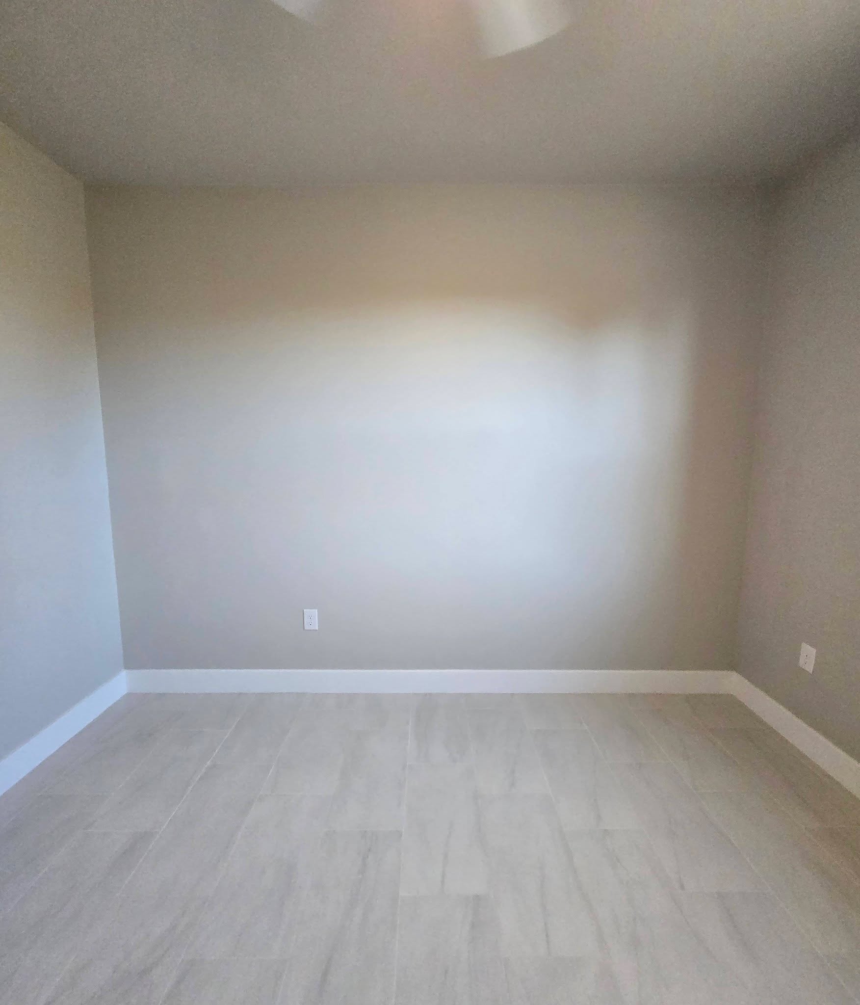 Nursery with bare wall and baseboard only